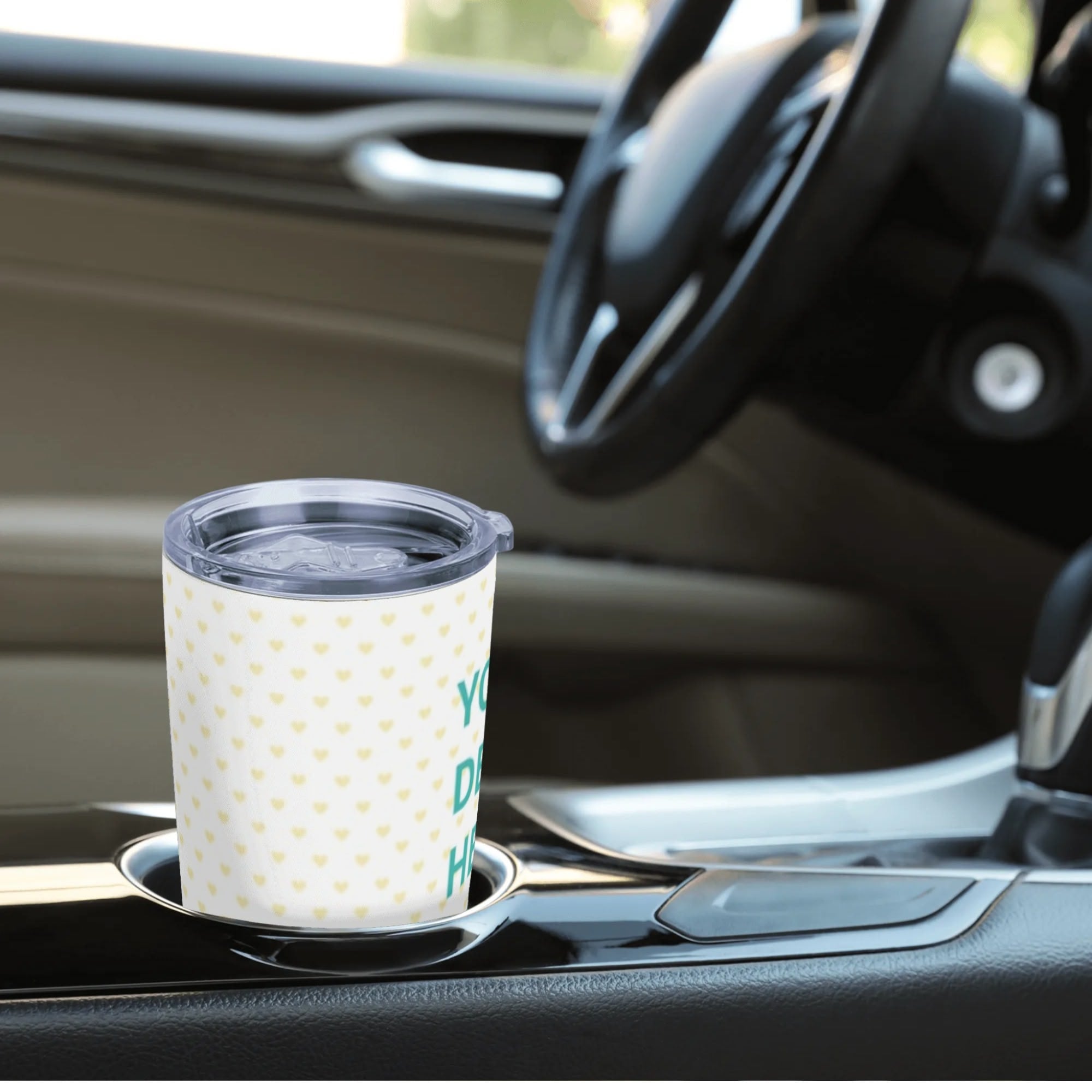 Personalized stainless steel travel tumbler with custom design, in car cup holder. Car coffee mug.