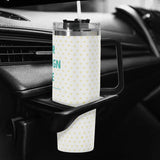 Personalized 40oz Stainless Steel Tumbler with heart pattern, black handle, and straw, in car