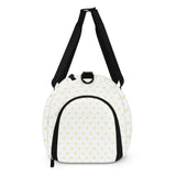 Personalized sports gym bag with yellow heart pattern and black straps. Travel luggage or tote bag.