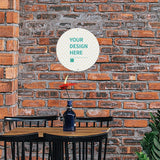Personalized aluminum plaque with 'YOUR DESIGN HERE' on brick wall, perfect cafe decor, personalized gifts.