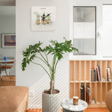 Square wooden wall clock with "grow" text and watercolor plants design for home decor.