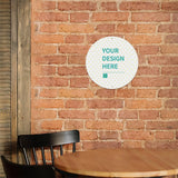 Customizable aluminum plaque with 'YOUR DESIGN HERE' on a brick wall, perfect cafe decor, personalized gifts.